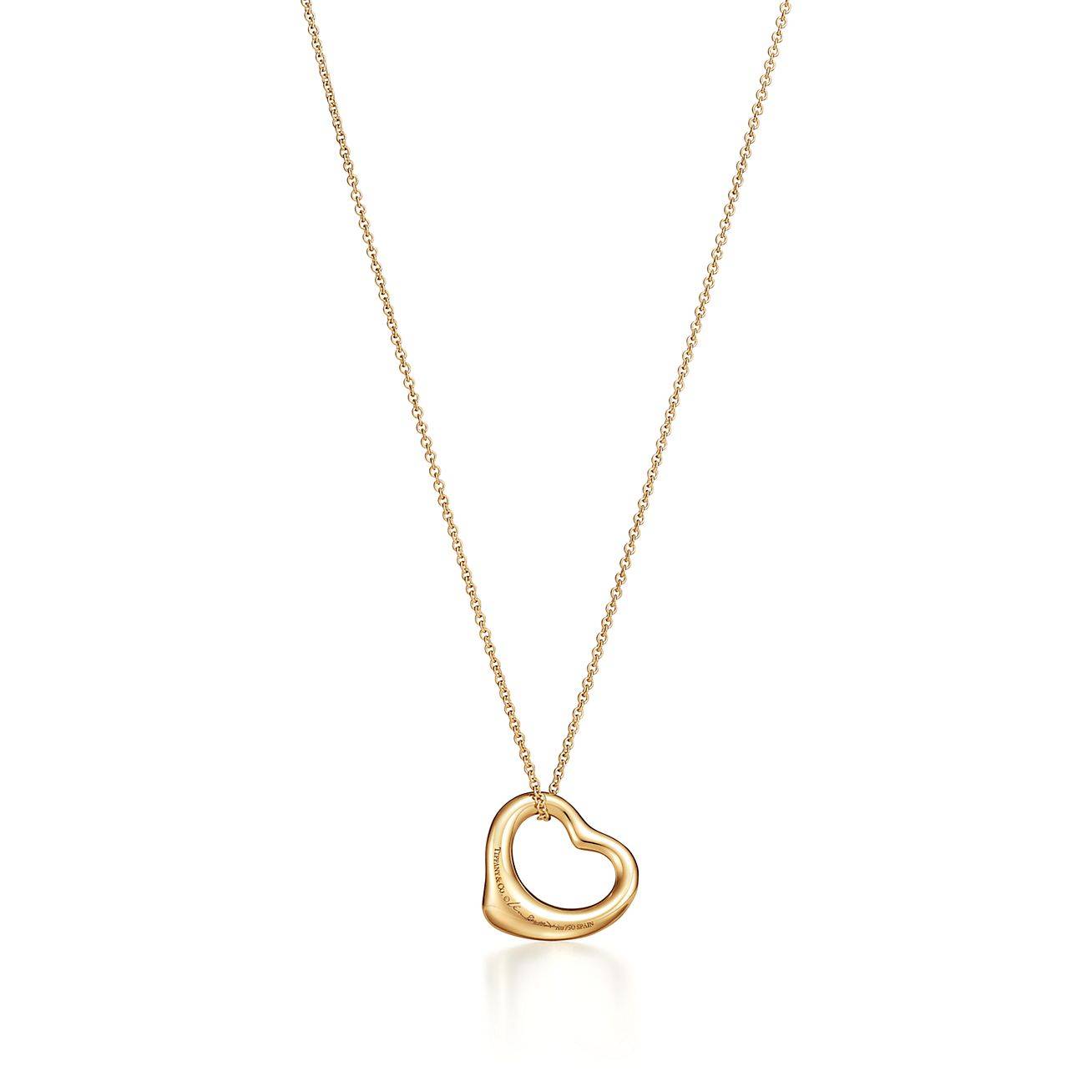 TIFFANY  ELSA PERETTI® OPEN HEART PENDANT IN YELLOW GOLD WITH EMERALDS, 16 MM